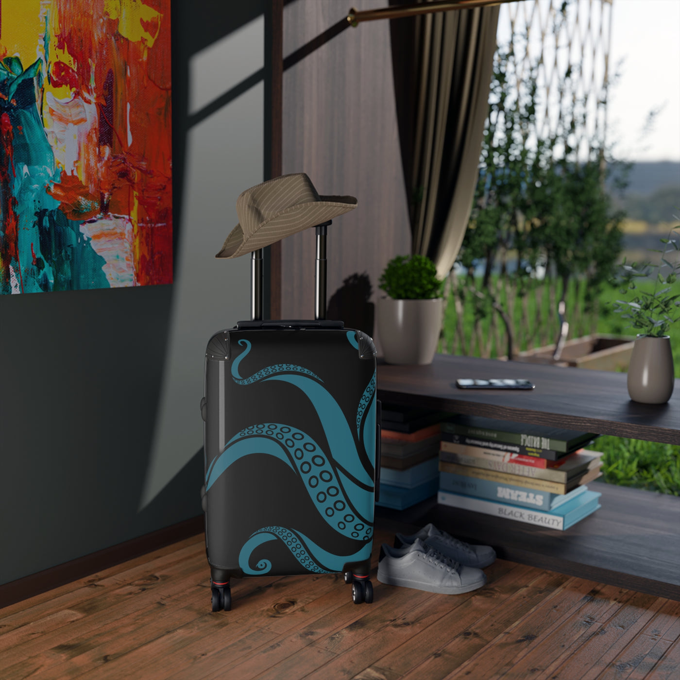 Teal tentacle suitcase with swivel wheels placed in cozy room, ideal for personalized luggage and travel essentials.