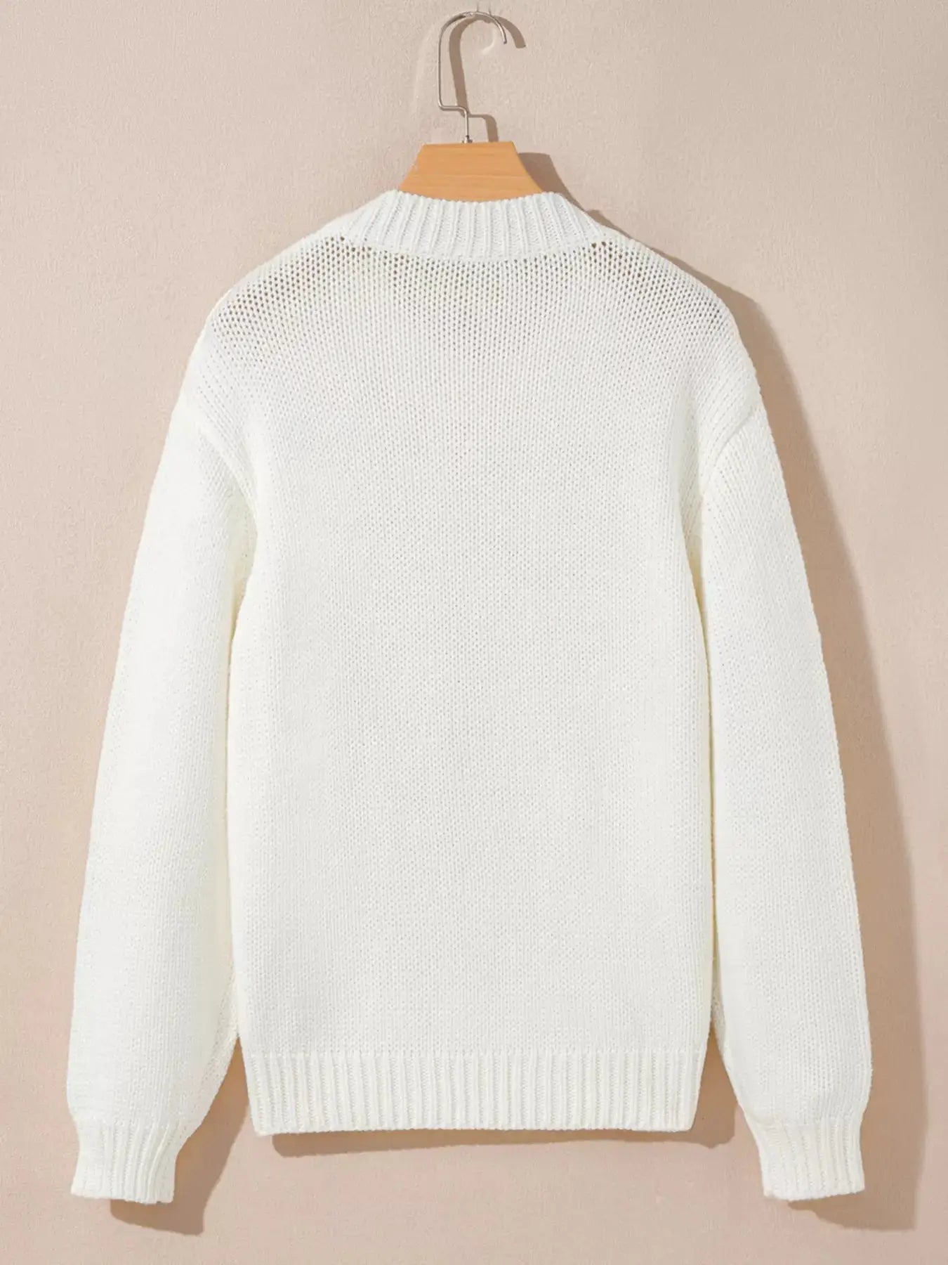 White embroidered drop shoulder sweater.
