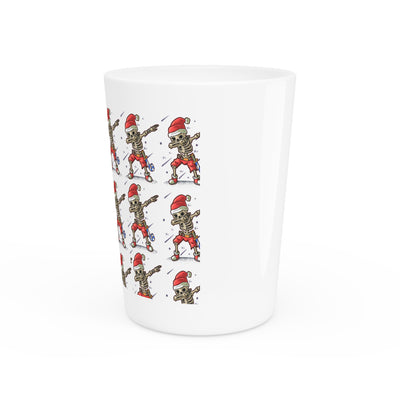 Ceramic shot glass with a repeating pattern of skeletons wearing Santa hats.