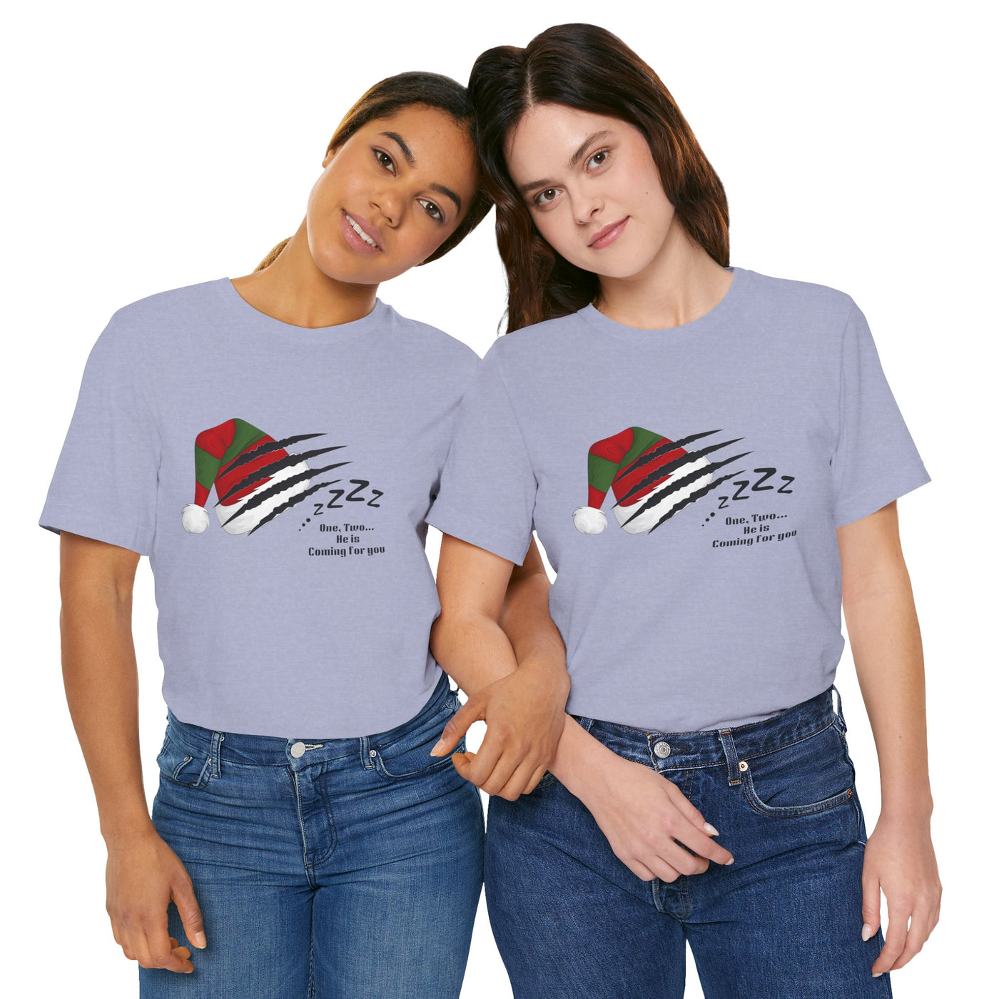 Two women wear light purple t-shirts with a graphic of a Santa hat with claw marks and "Zzz" text.