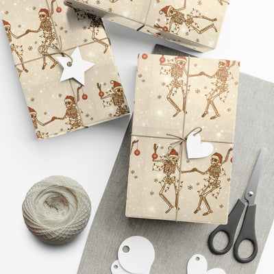 Gift wrap with a black and white skeleton design and festive lights.