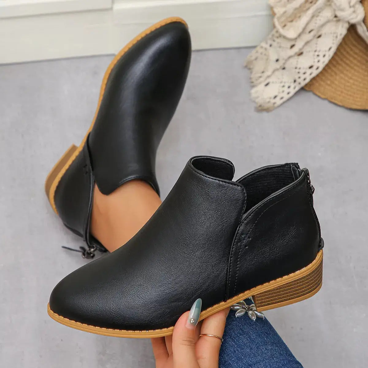 Black PU leather pointed toe block heel booties with a side zipper.