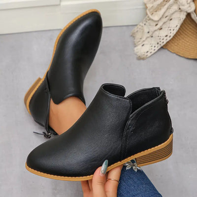 Black PU leather pointed toe block heel booties with a side zipper.
