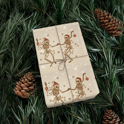 Gift wrap with a skeleton and Christmas light pattern on a tan background.