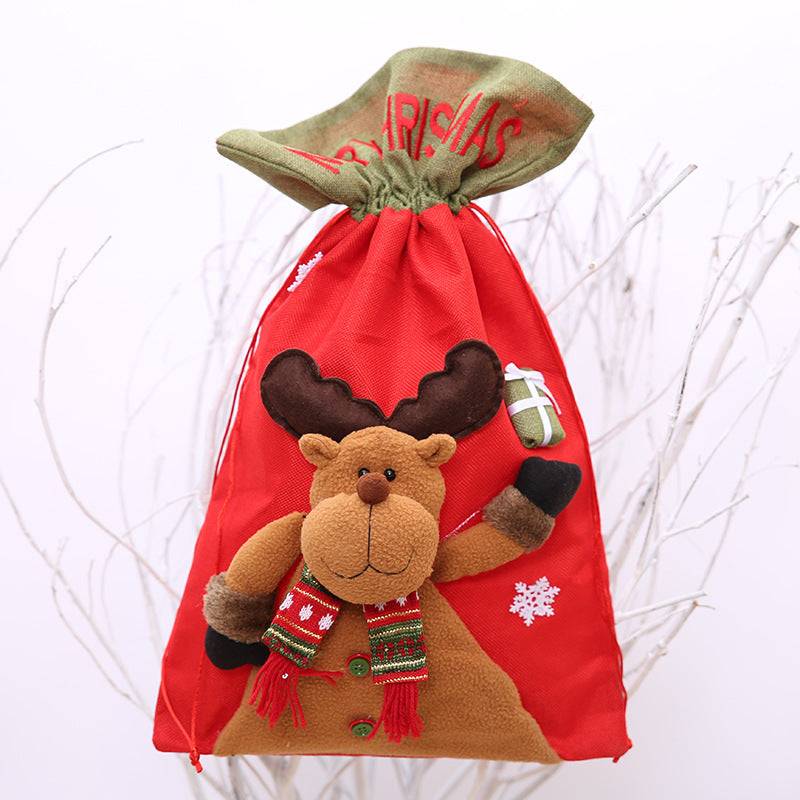 Red drawstring Christmas gift bag with a reindeer applique.