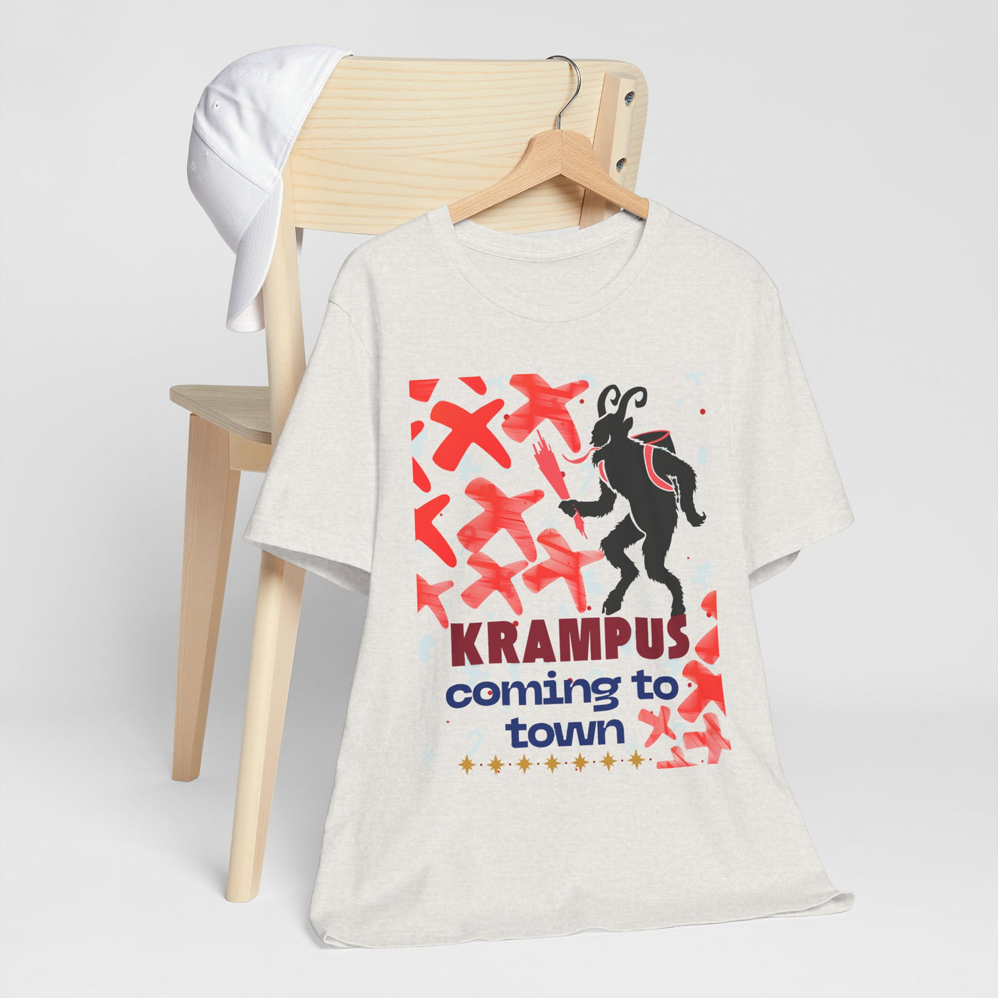 A white t-shirt with a Krampus graphic and text.