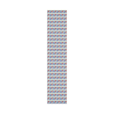 Gift wrap paper with a repeating pattern of skulls wearing Santa hats and "Happy Holidays" text.