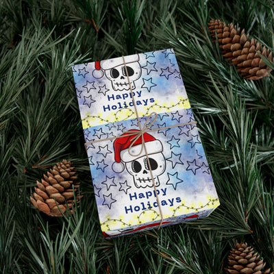Gift wrap with a skull wearing a Santa hat and stars on a blue background.