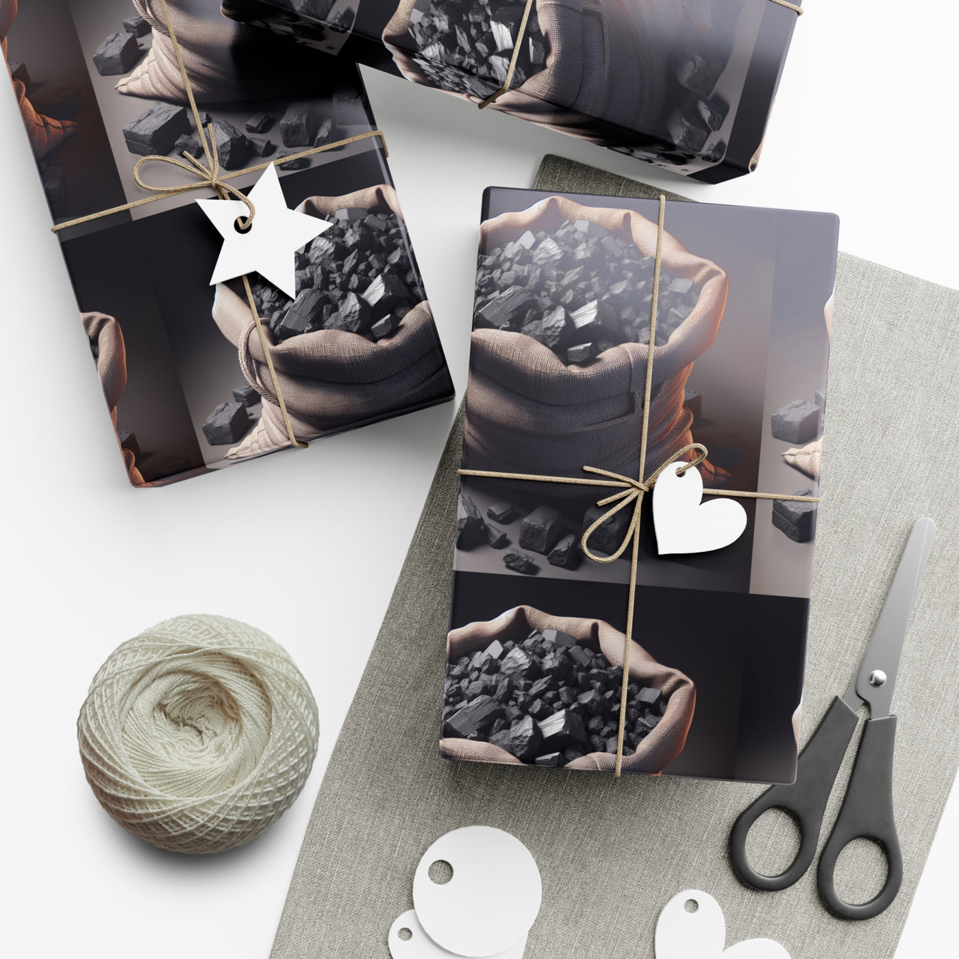 Gift wrap paper featuring bags of coal with twine and gift tags.