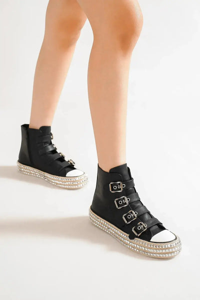 Black high-top sneakers with multiple buckle straps and studded platform soles.