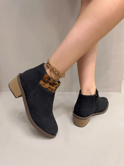 Black suede ankle boots with leopard print detail and block heels.
