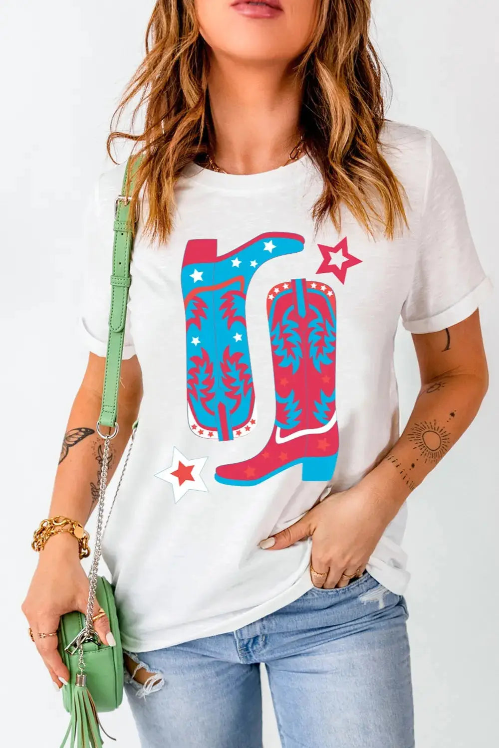 White t-shirt with a red, white, and blue cowboy boot graphic.