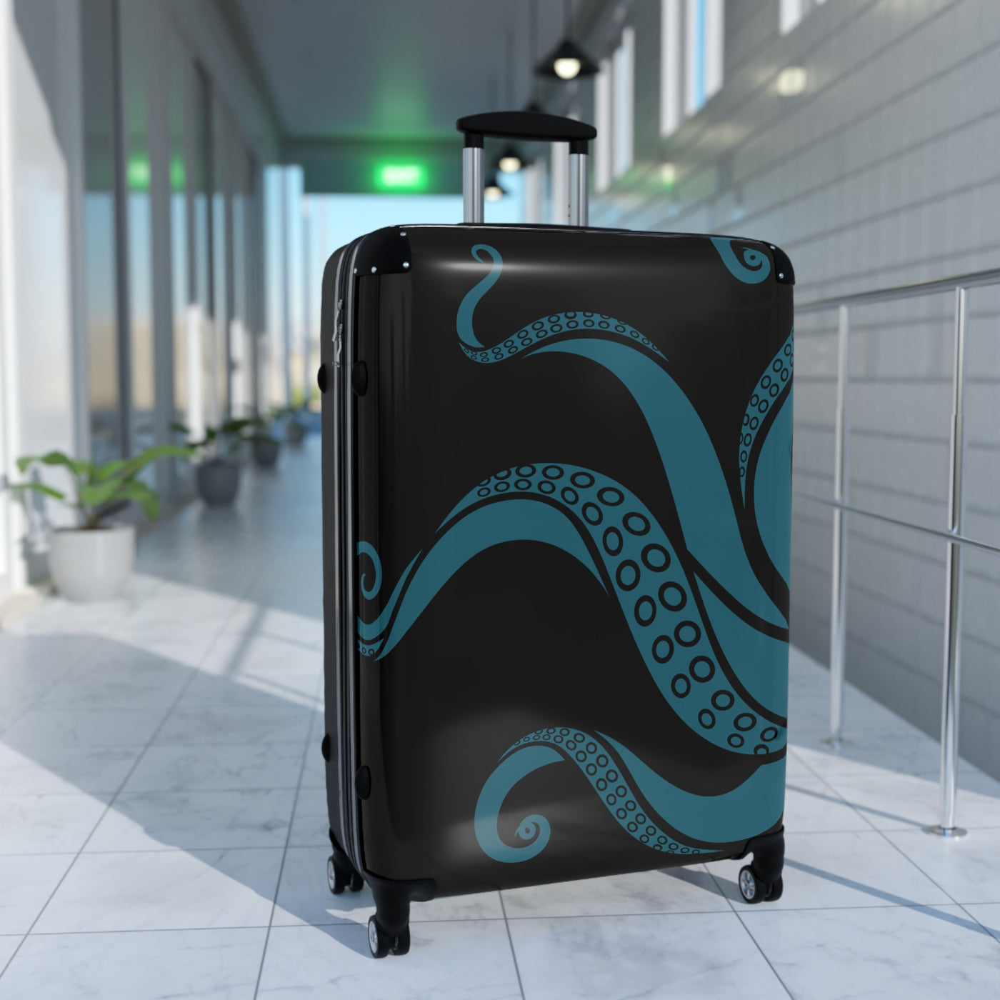 Large teal tentacle suitcase with swivel wheels in modern hallway, perfect for ocean-themed travel accessories.