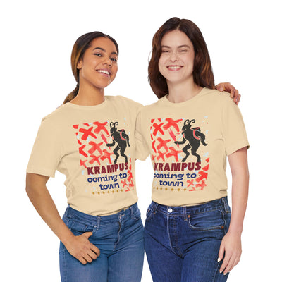 Two women in tan t-shirts with a Krampus graphic and text.