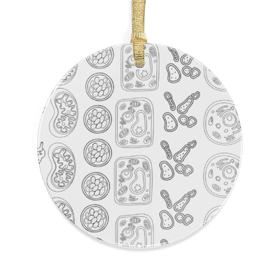 Round ornament with a pattern of scientific cell drawings and a gold ribbon.