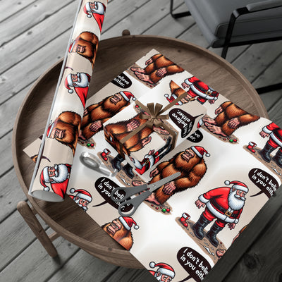 Wrapping paper with Santa and Bigfoot illustrations and "I don't believe in you either" text.