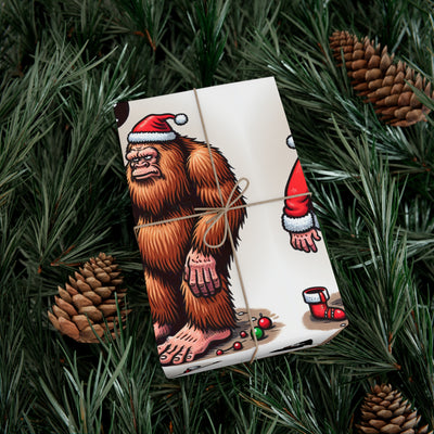 Wrapping paper with Bigfoot and Santa Claus in Santa hats.