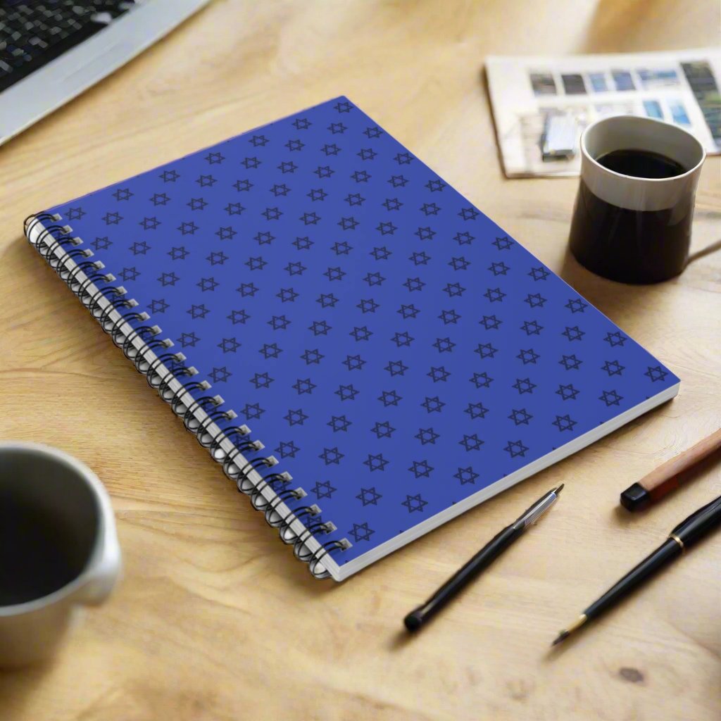 Blue spiral notebook with a repeating star pattern.