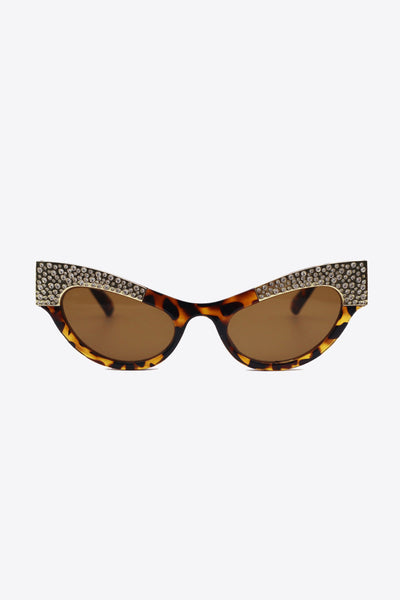 Cat-eye sunglasses with tortoise shell frames and rhinestone trim.