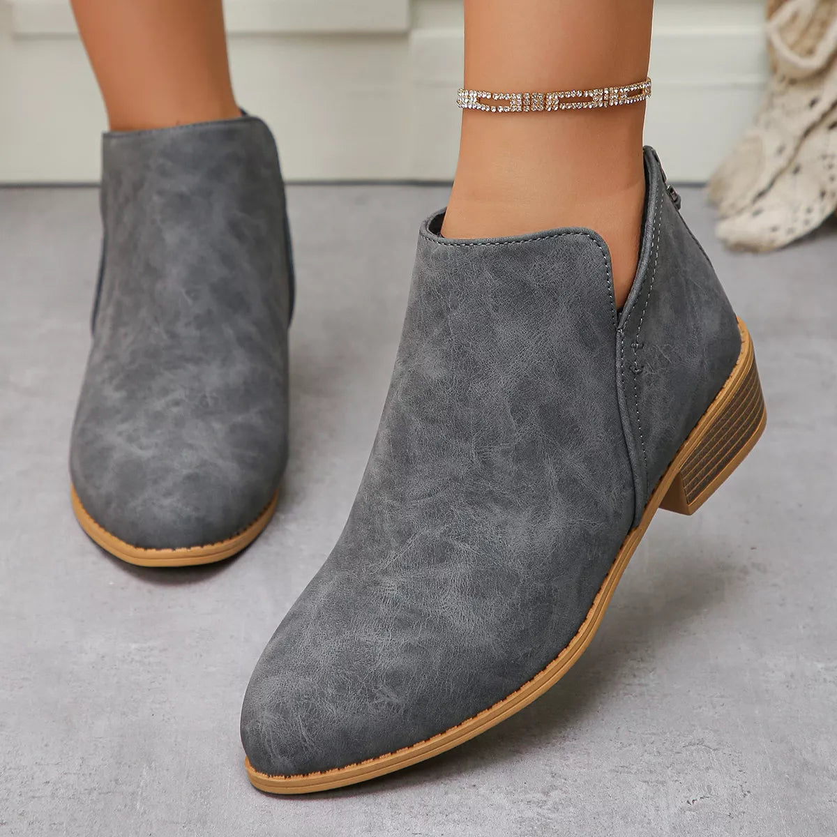 Grey PU leather pointed toe block heel booties with a low heel.