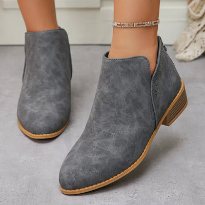 Grey PU leather pointed toe block heel booties with a low heel.