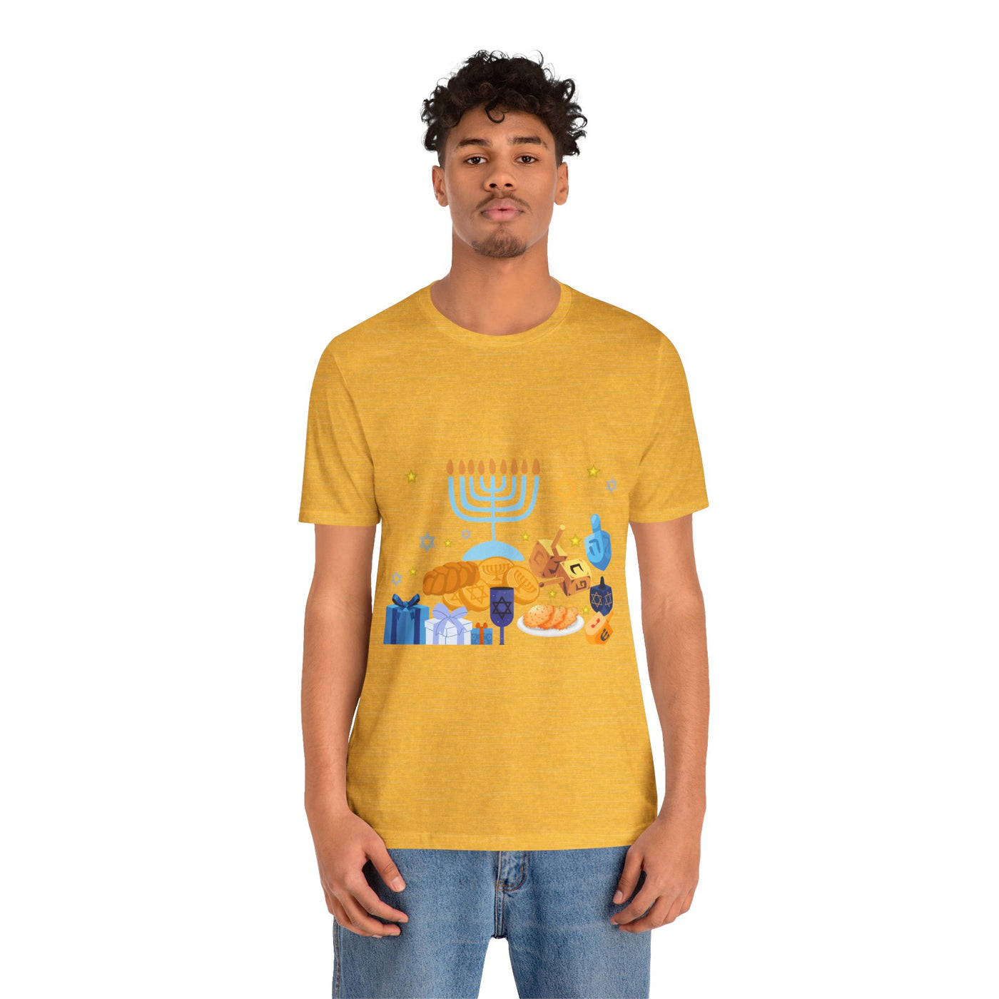 Yellow t-shirt with a graphic of Hanukkah symbols including a menorah, dreidels, and gelt.