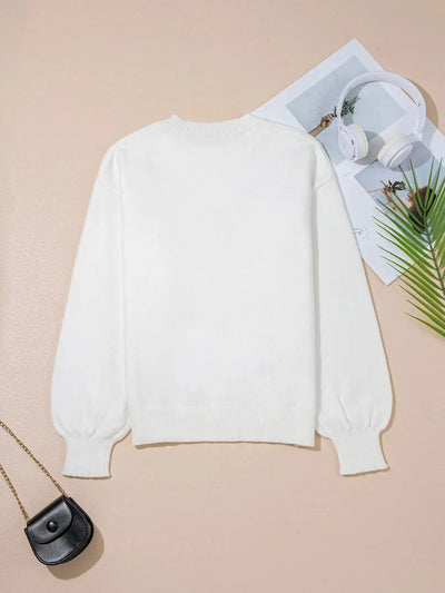 White knit sweater with balloon sleeves and ribbed cuffs.