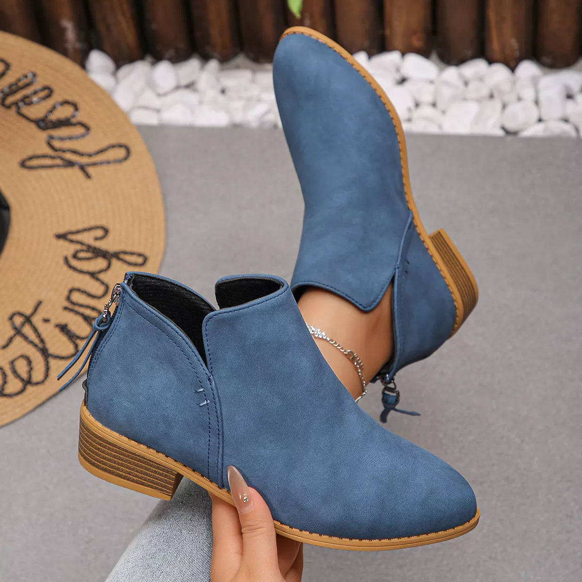 Blue pointed toe block heel booties made of PU leather.