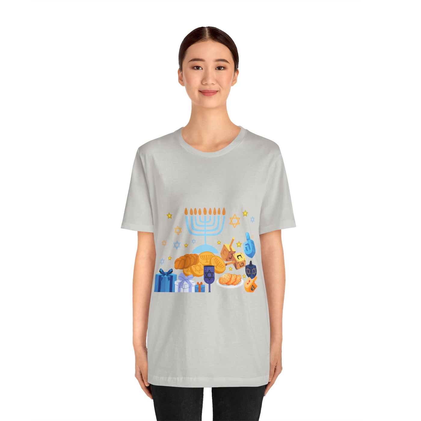Light grey t-shirt with a colorful Hanukkah graphic featuring a menorah, dreidels, gelt, and gifts.
