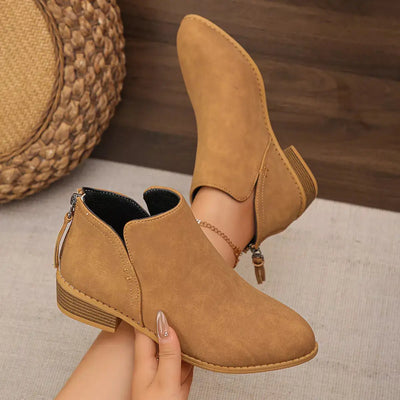 Pointed toe brown PU leather block heel booties with a side zipper.