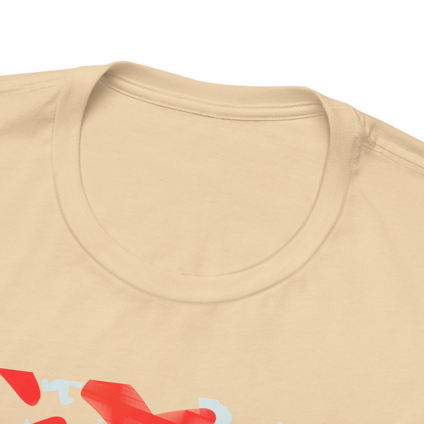 A close-up of a tan t-shirt with a graphic design.