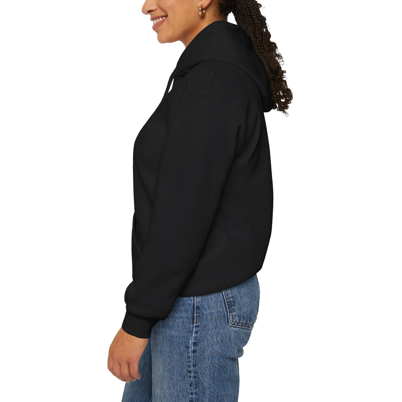 Black hoodie on a woman wearing blue jeans.