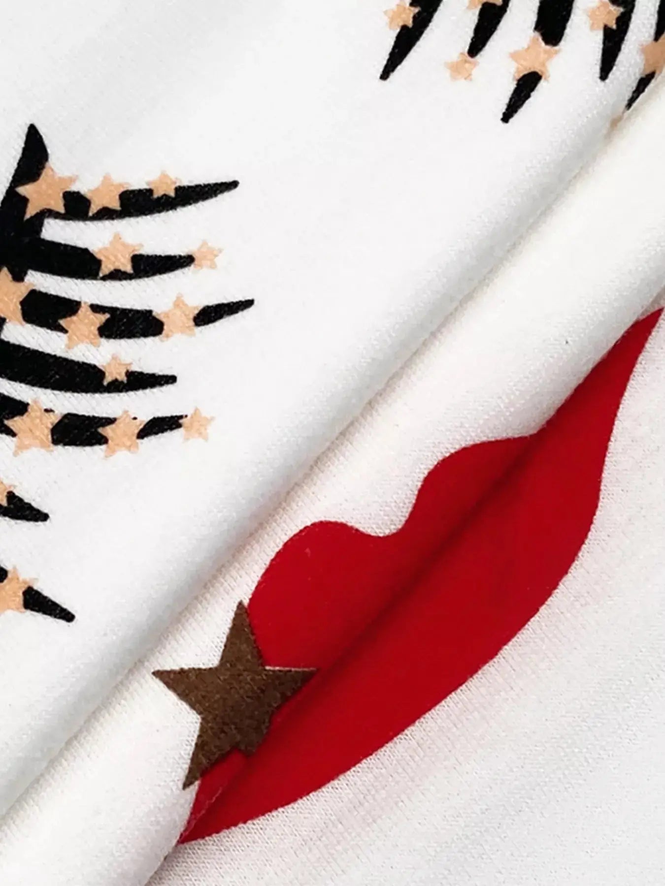 Graphic t-shirt with black stripes, stars, and red lips design.