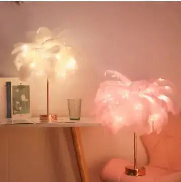 Two feather table lamps, one white and one pink, with LED lights.