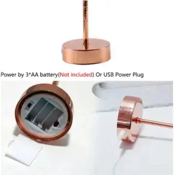 Copper base of a table lamp showing battery compartment and USB port.
