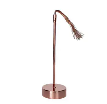 Rose gold lamp base with a thin stem and a cluster of delicate lights at the top.
