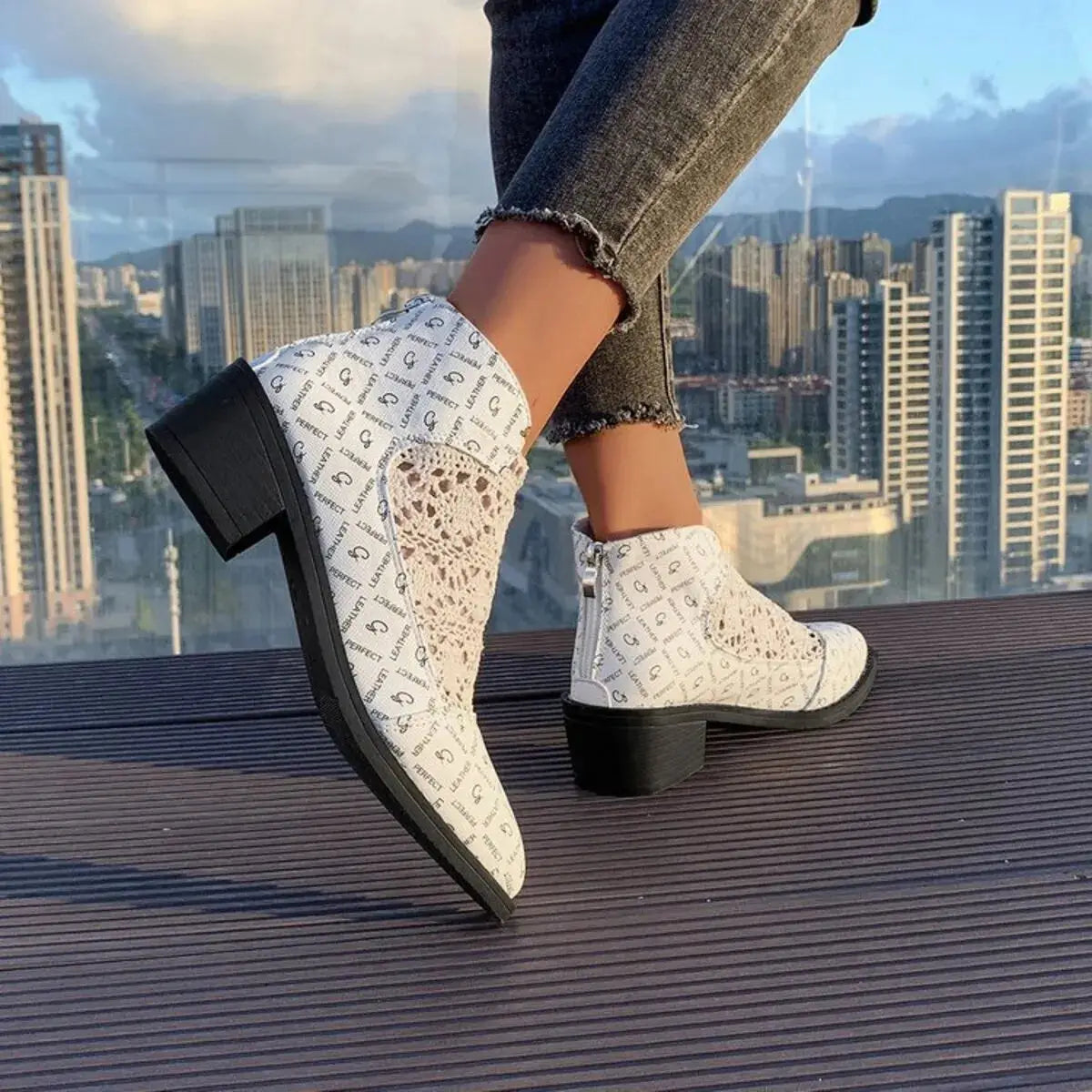 White mesh and PU leather ankle boots with a printed pattern and low block heel.