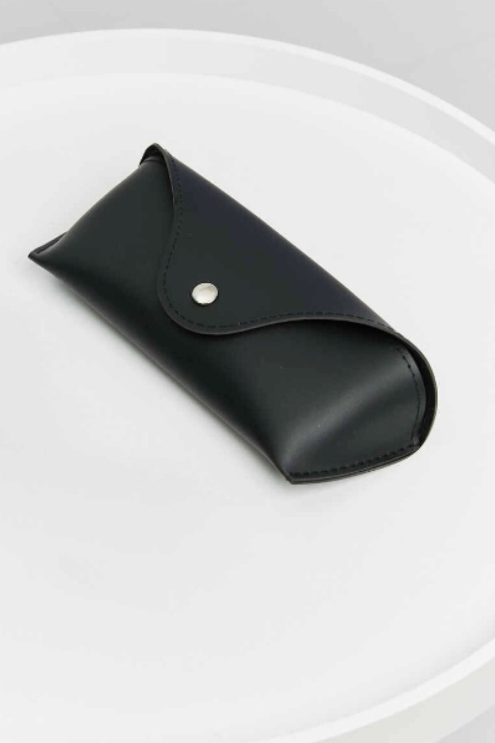 Black cat-eye sunglasses case with a snap closure.