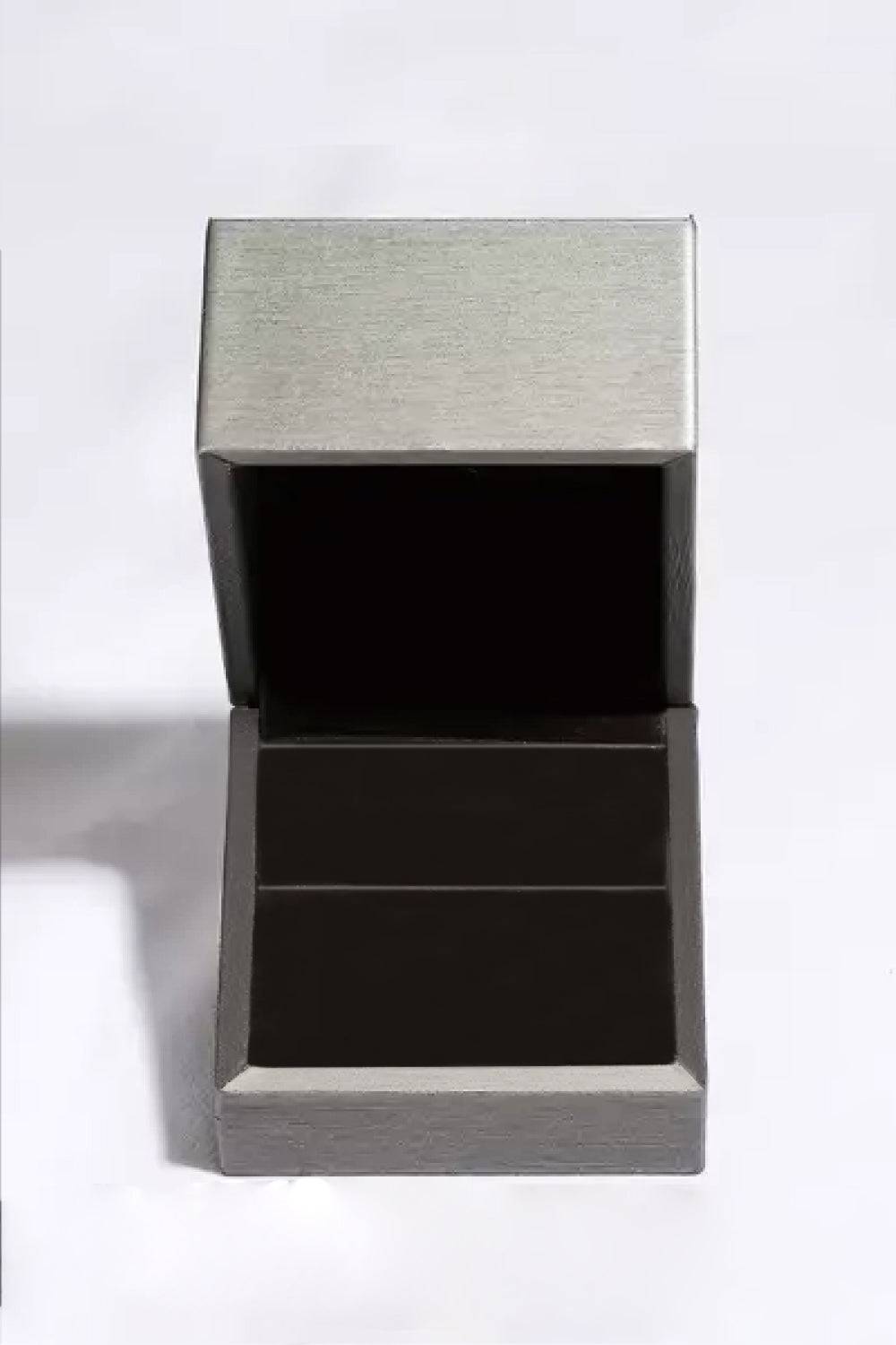 An open, gray ring box with a black interior.