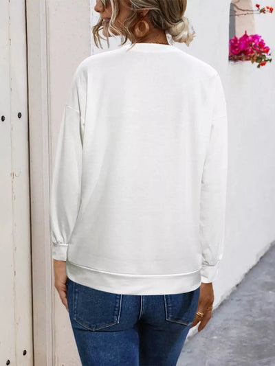 White graphic t-shirt with round neck and comfortable fit.