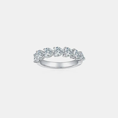 A sterling silver ring with seven heart-shaped moissanite stones.