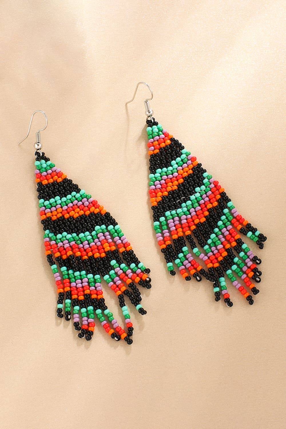 Colorful beaded fringe earrings with a triangular shape.