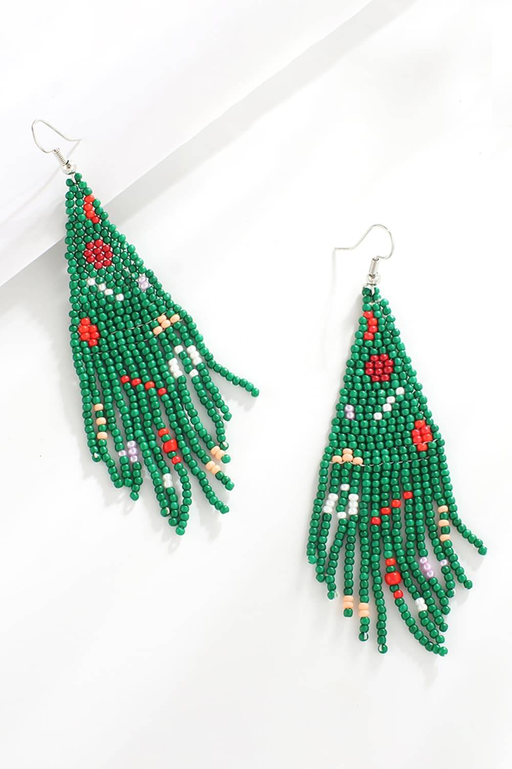Green beaded Christmas tree shaped dangle earrings with colorful accents.