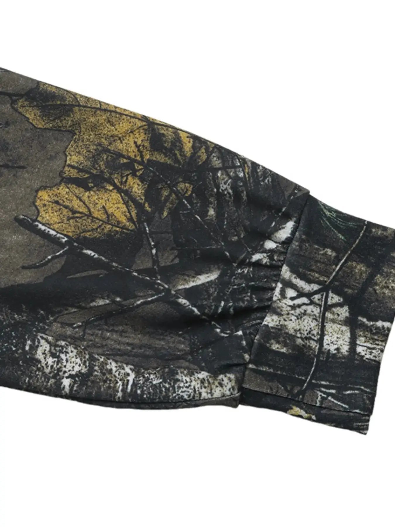 Asymmetrical long sleeve top with a camouflage print.