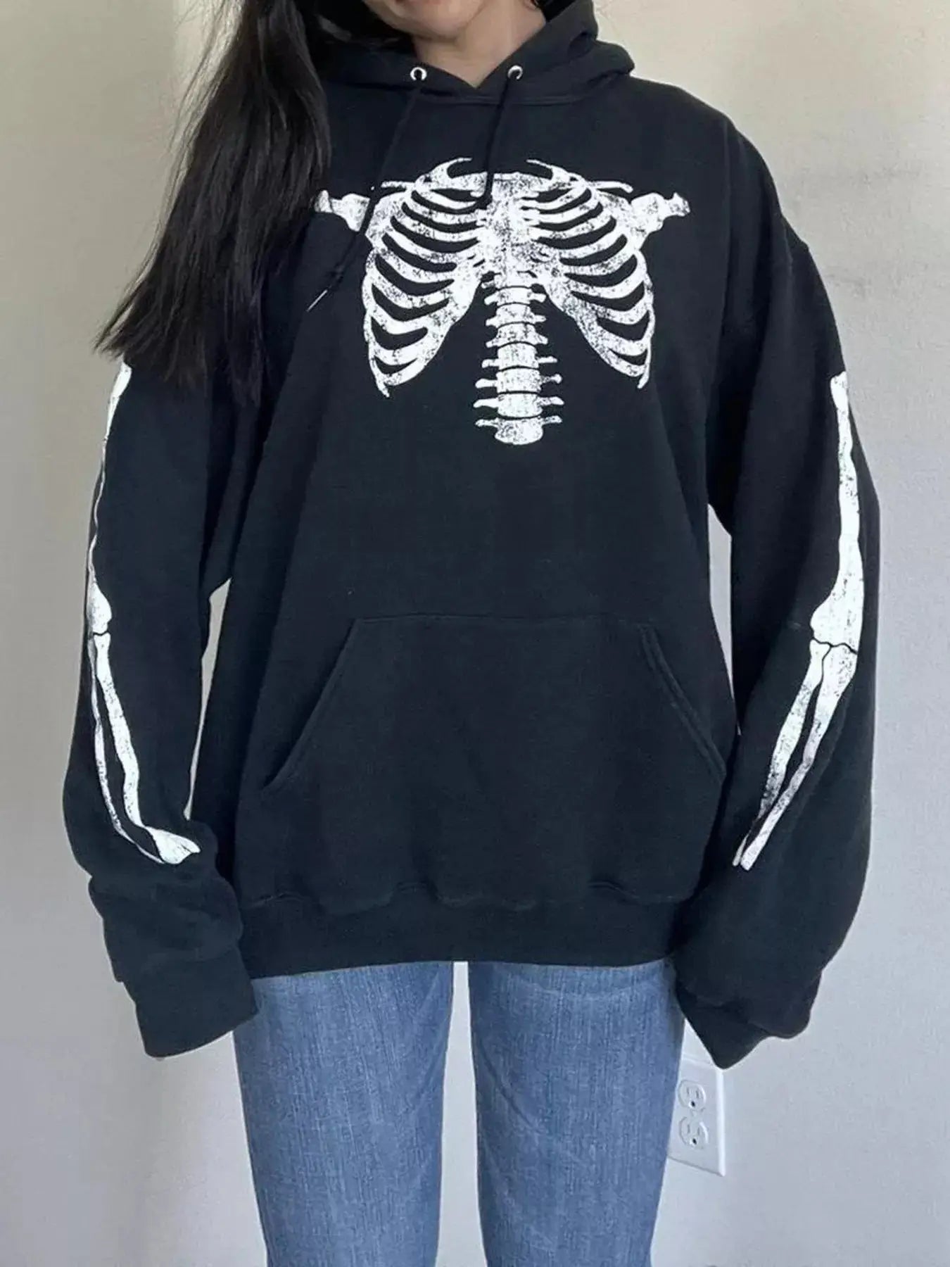 Black long sleeve hoodie with a white skeleton graphic.