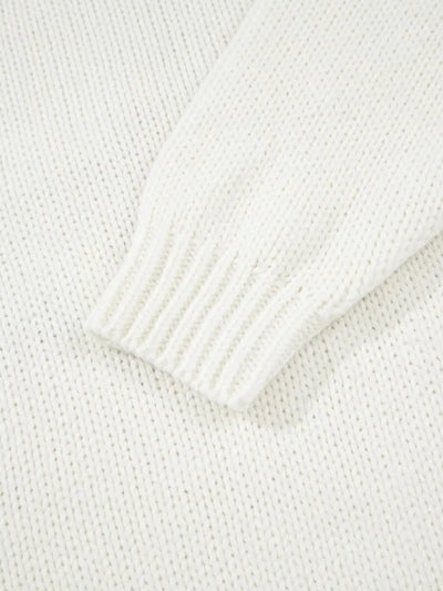 A white knit sweater with a ribbed cuff.