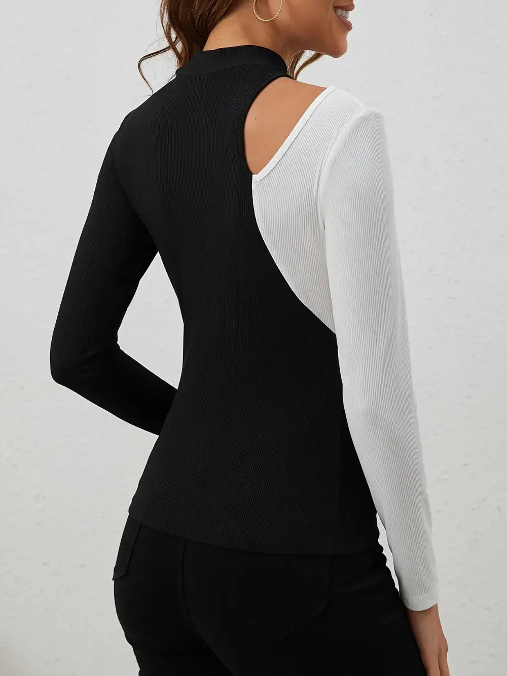 Black and white long sleeve t-shirt with a cutout and mock neck.