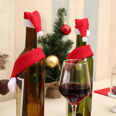 Christmas wine bottle covers with Santa hats and scarves.