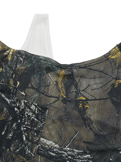 Asymmetrical long sleeve top with a camouflage print and cutout detail.